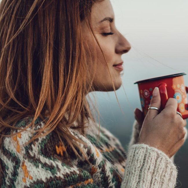 Woman enjoying a hot drink in winter